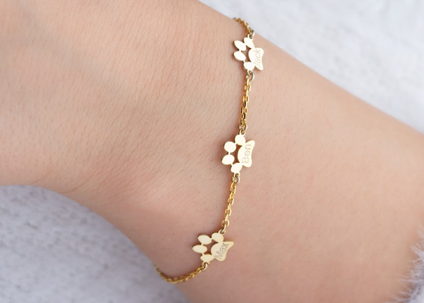 Braccialetto con ciondolo a forma di zampa